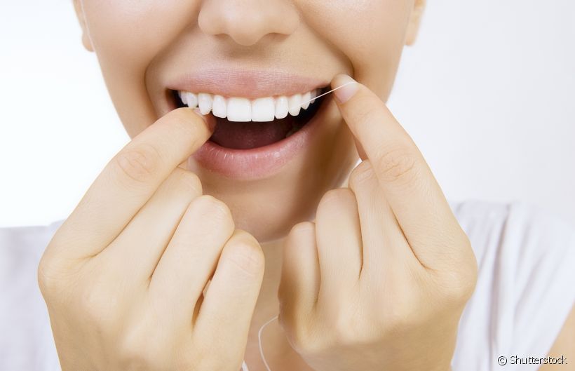 Como prevenir cárie entre os dentes por falta de fio dental