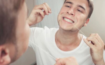 Preciso passar fio dental no dente implantado?